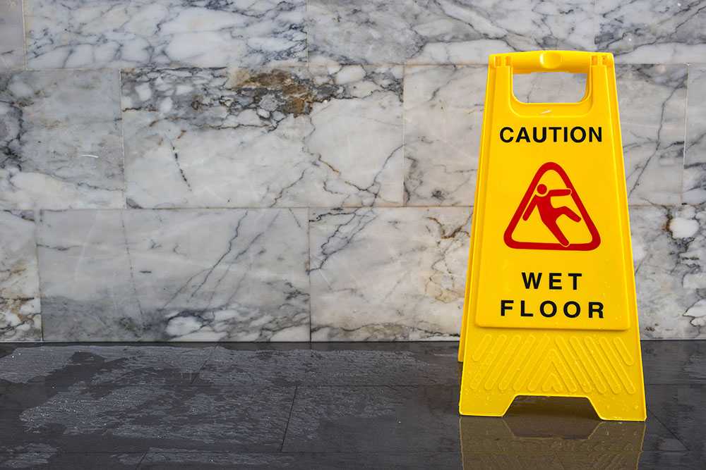 Wet Floor with Yellow Caution Sign